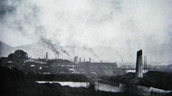 A bird's eye view of Jingdezhen showing some of its chimneys