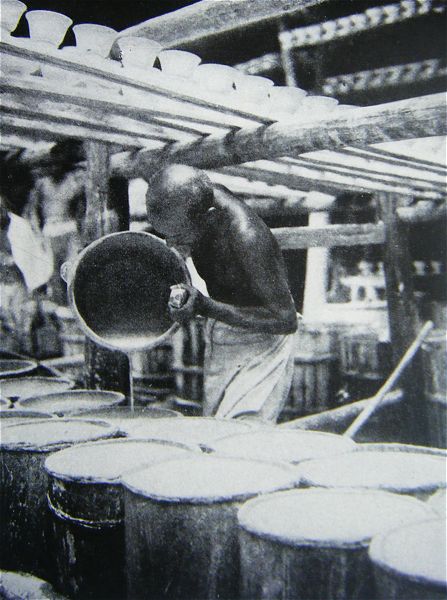 This milk-like liquid is the porcelain glaze ready to be blown or brushed upon the potters' product